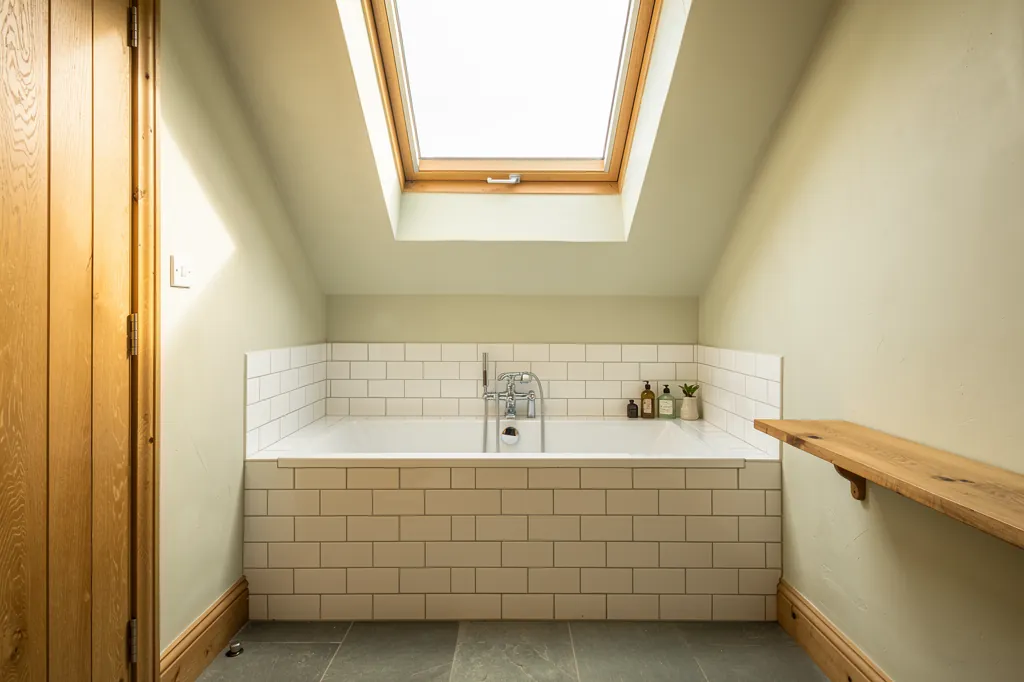An opening rooflight venting a bathroom