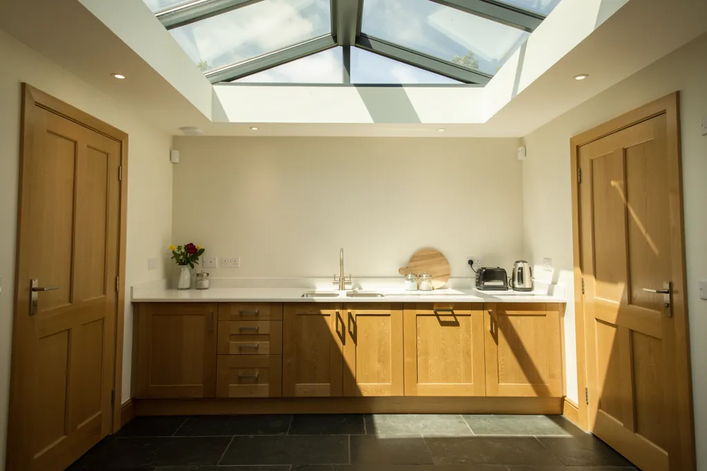 A kitchen under a rooflight with solar control glass