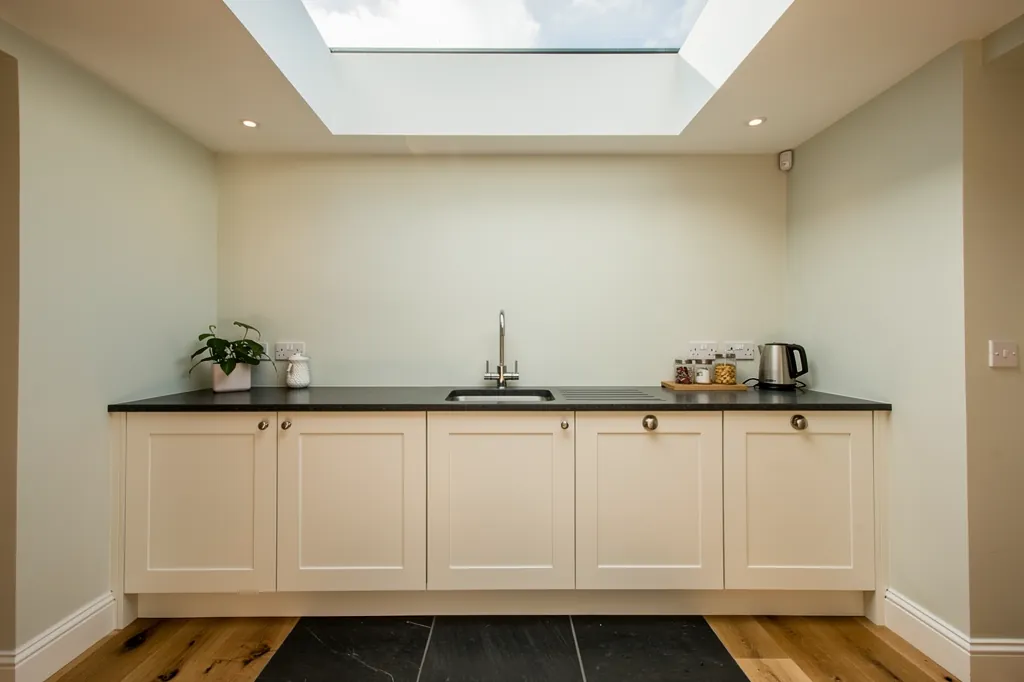 A flat rooflight above a kitchen worktop