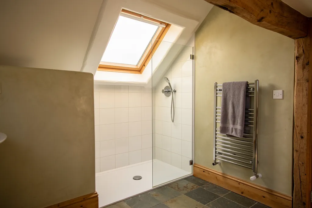 A roof window over a loft shower room