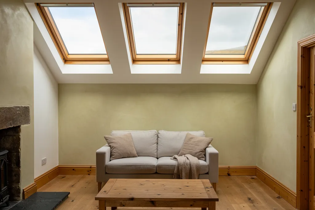 Centre-pivot roof windows in a bright loft room