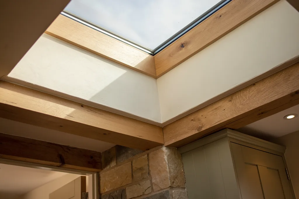 Looking up through a walk-on rooflight from a basement kitchen
